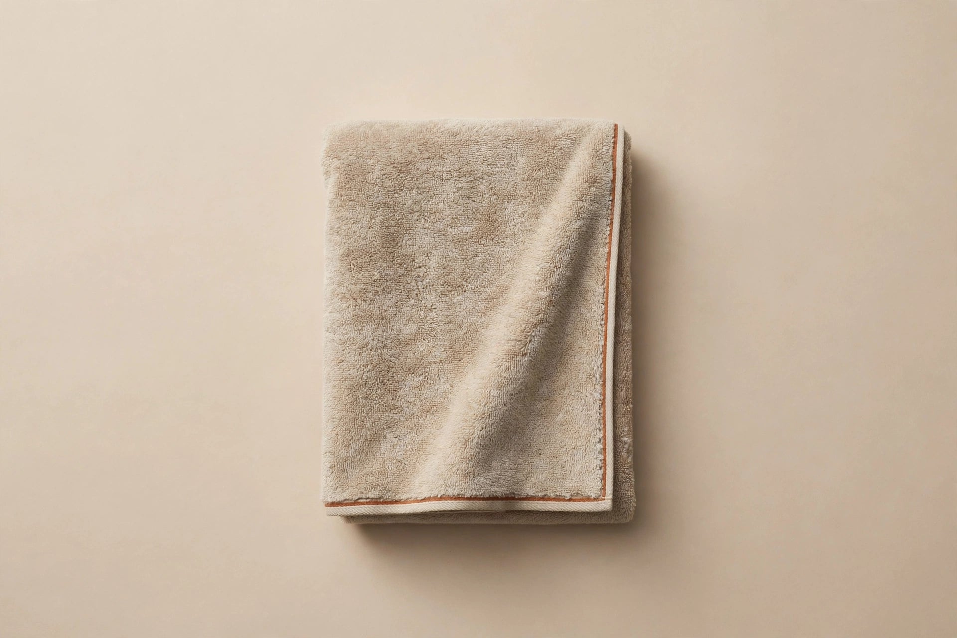Concept visualization of sand and stone Atrani Duna beach towel with one terracotta border line